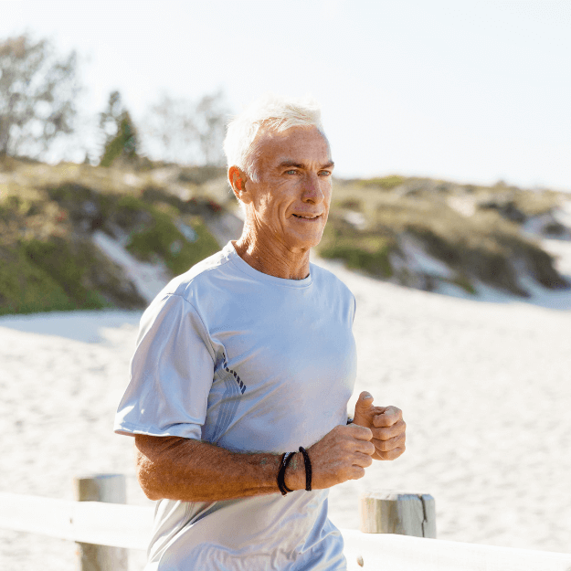 A healthy looking older man running depicting health from grass-fed meat