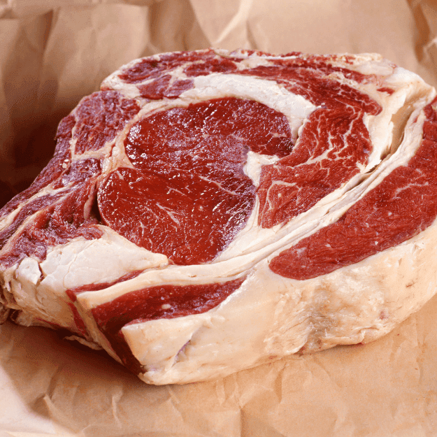A fatty ribeye steak showing the type of fat in muscle meat