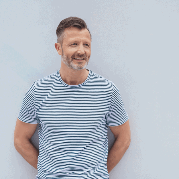 A healthy looking middle aged man denoting the benefits of bene broth when aging