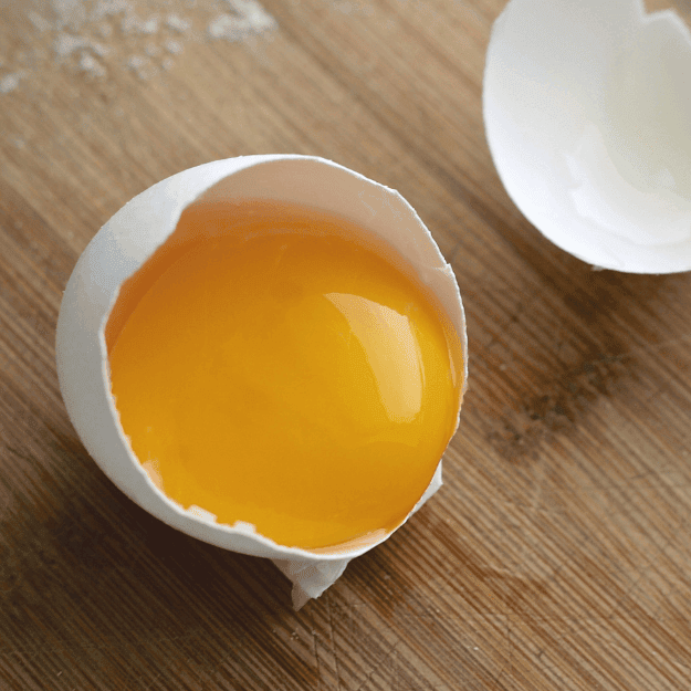 An egg yolk in its shell