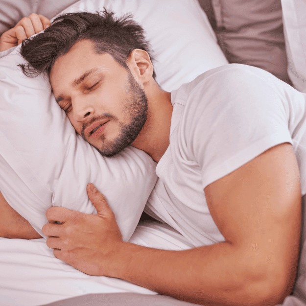 A man sleeping peacefully denoting restful sleep from bone broth