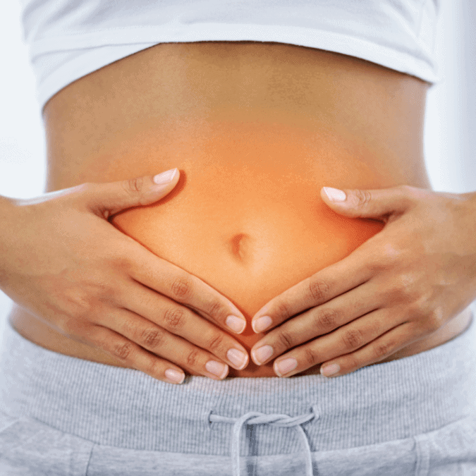 A woman stomach glowing depicting Gut Health & Intestinal Permeability from taking colostrum